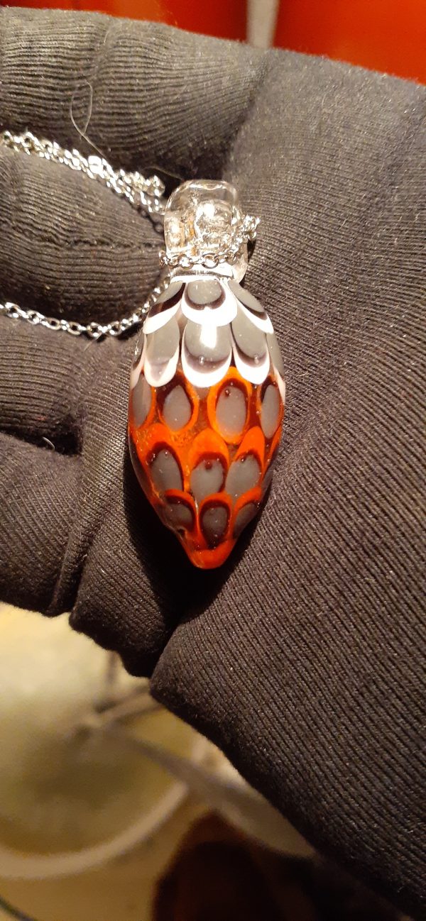 An orange pendant necklace